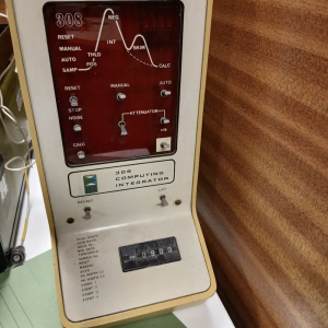Vintage red-panel electronic instrument with dials – retro lab prop