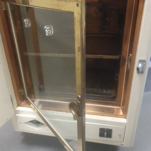 Vintage cream laboratory drying oven with door open – retro prop