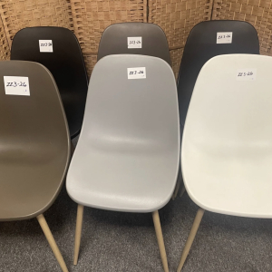 Grey and white moulded chairs – set dressing