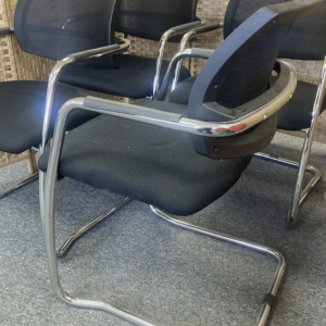 Black cantilever chairs with chrome frames – set dressing