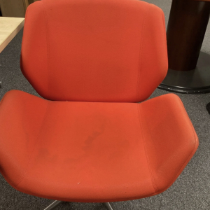 Orange upholstered chair – retro set dressing