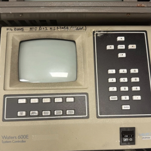 Vintage computer terminal with green screen and keypad – retro prop